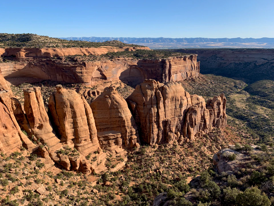 Towering red rock formations dominate the Grand Canyon's vast landscape from above