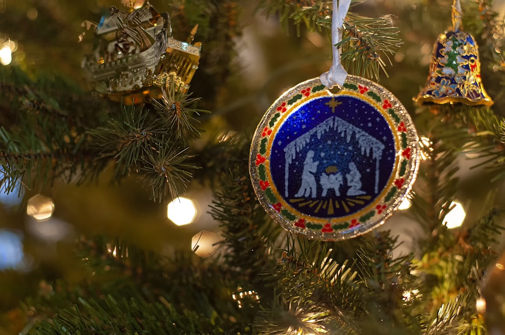 a christmas ornament hanging from a christmas tree