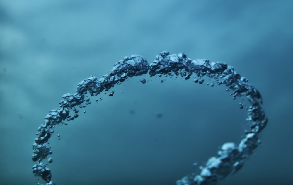 a circle of bubbles floating in the water