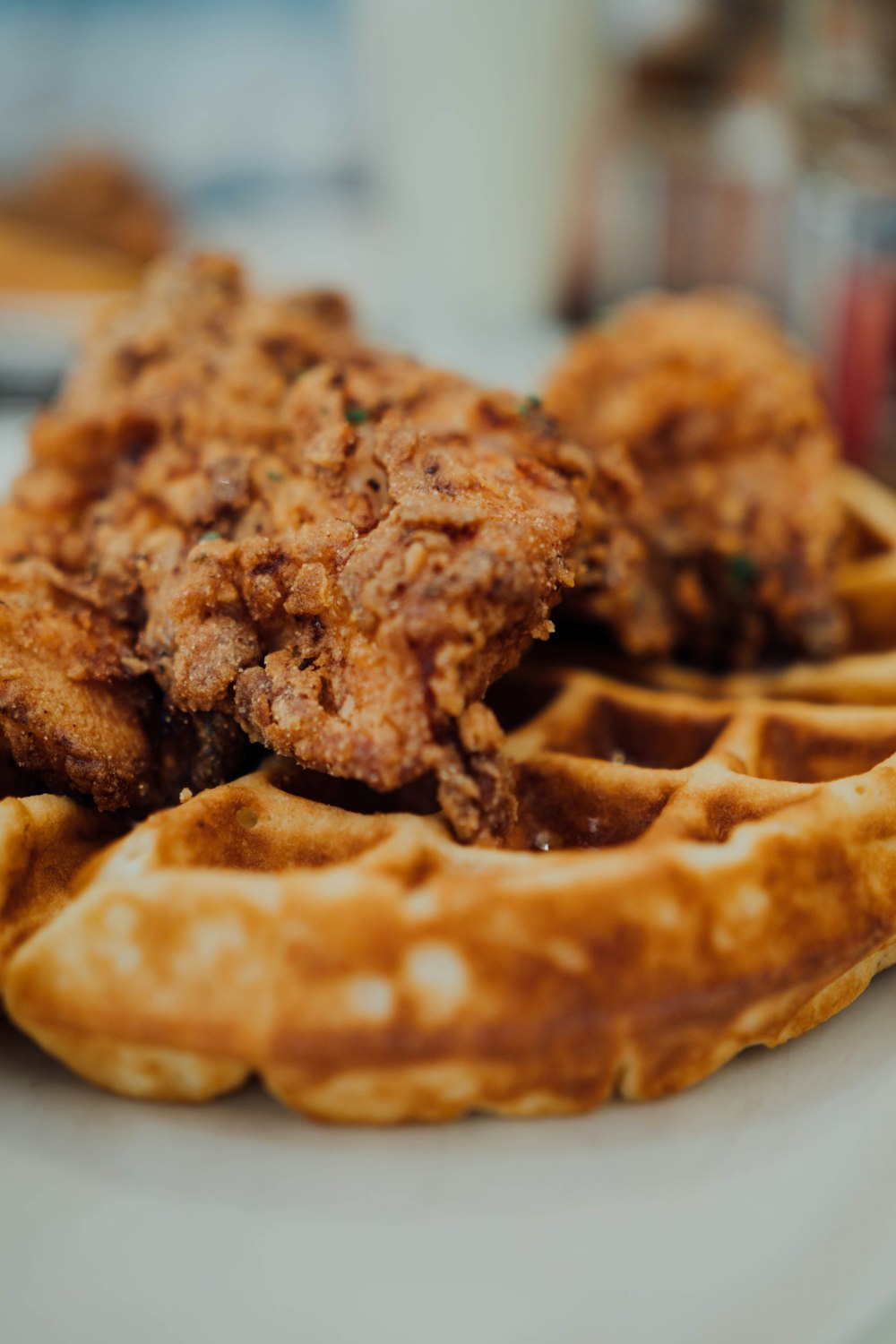 fried chicken and waffles on a white plate