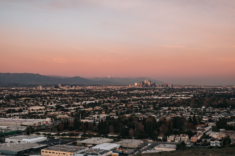 a view of a city with mountains in the background