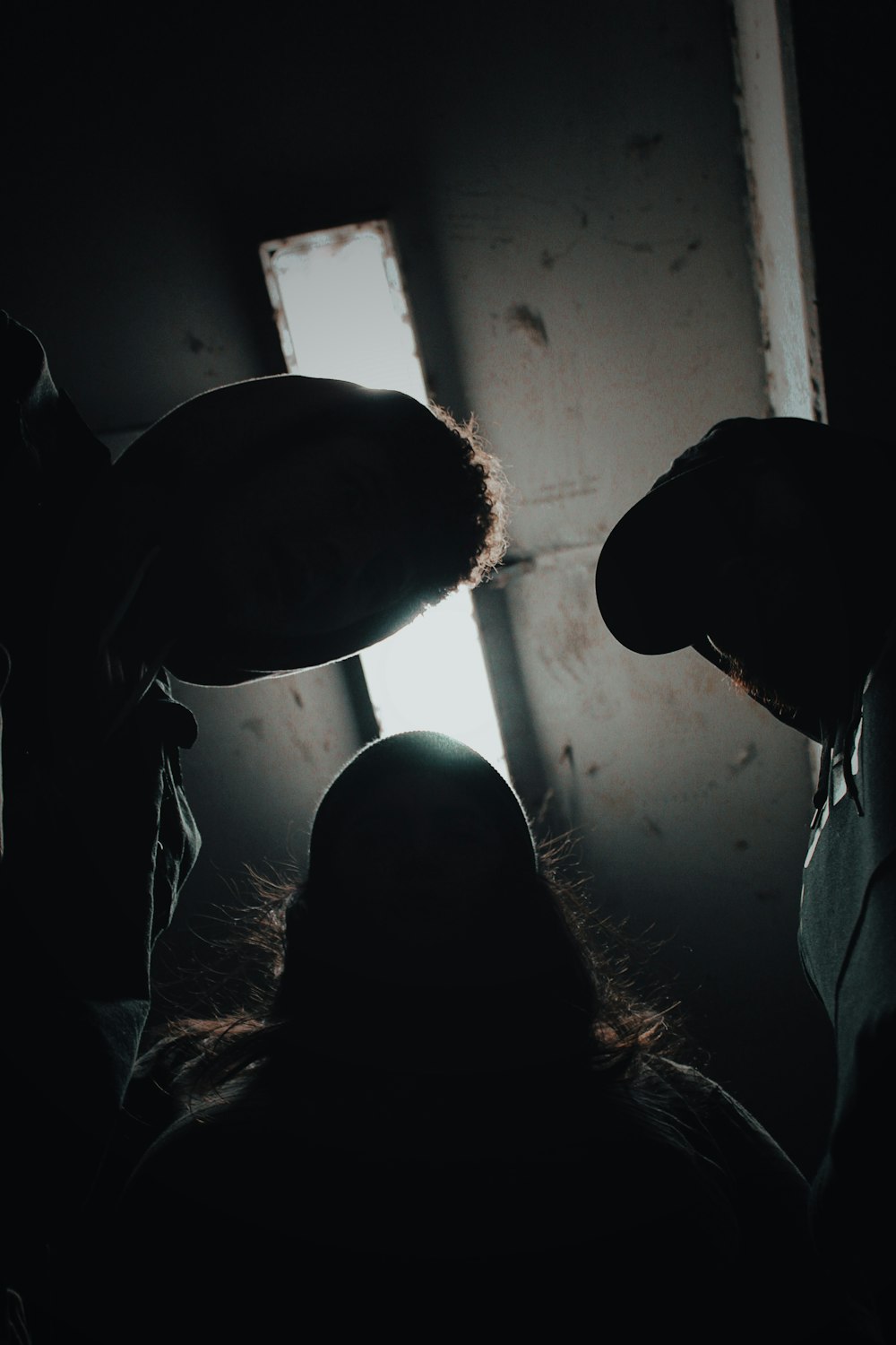 a group of people standing in a dark room