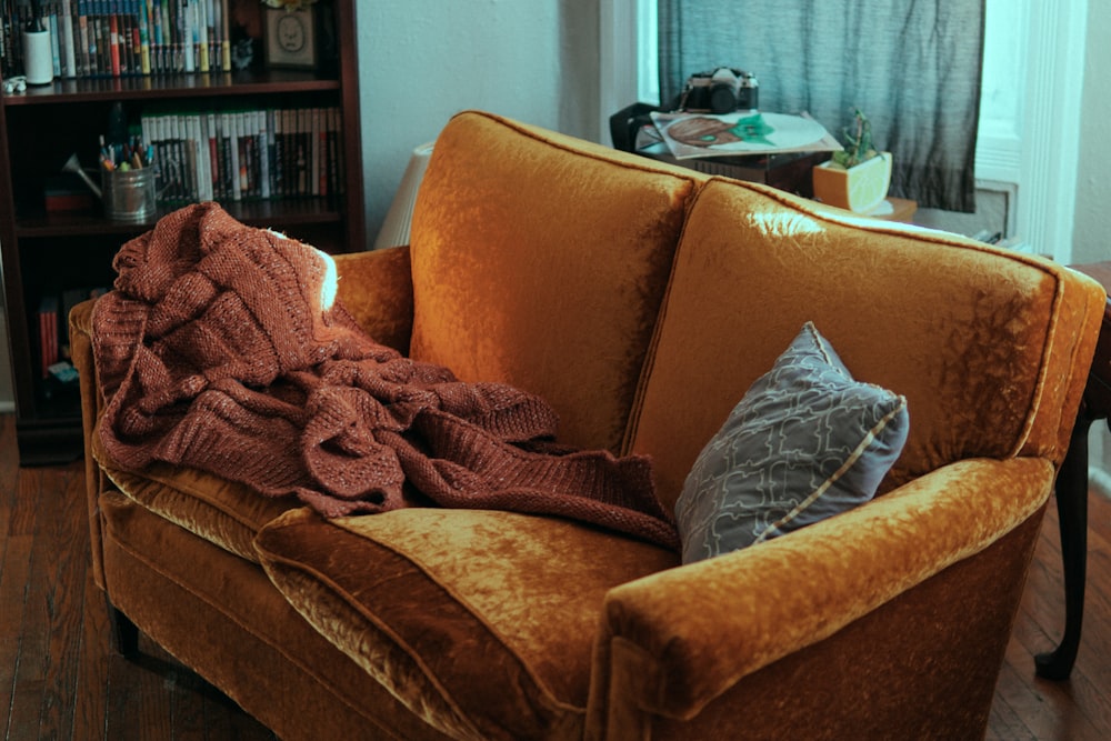 blanket and pillow on sofa