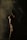 standing man in dim room