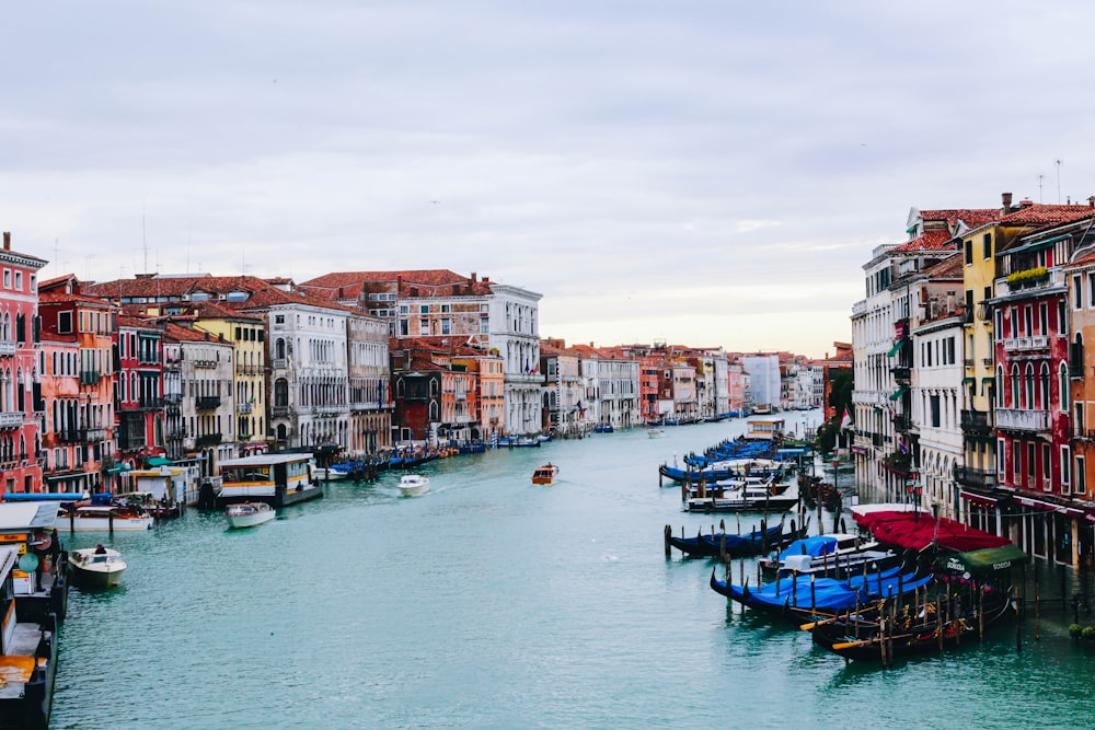 a waterway with boats and buildings on both sides