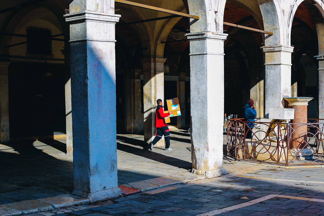 man carrying boxes