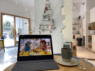 A cozy restaurant interior with minimalist decor and a tablet showing the joe table reservation screen.