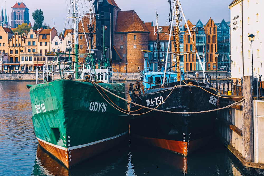 two black and green boats during daytime