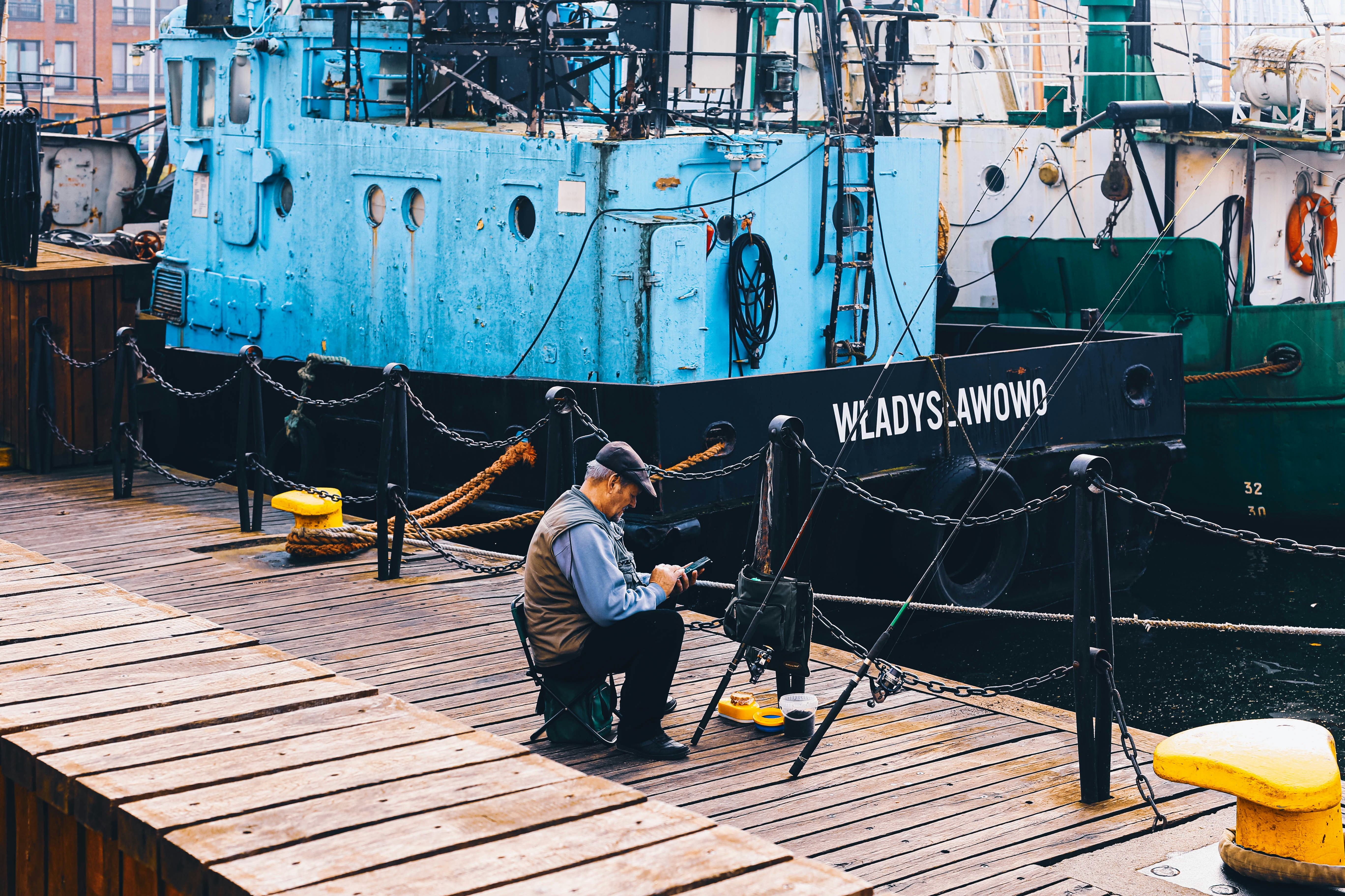 man fishing on dock