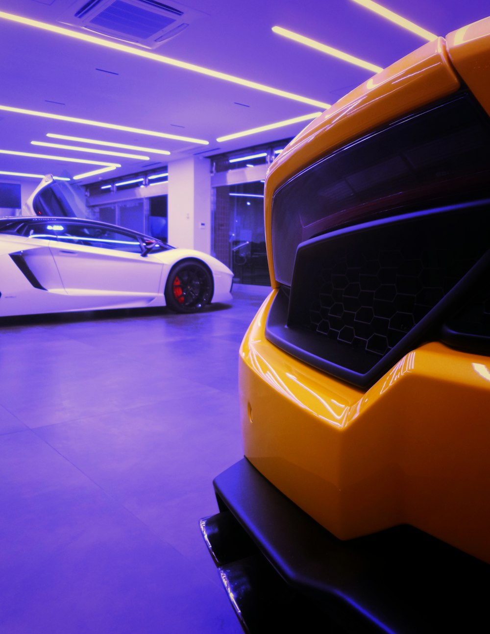 parked white coupe in garage