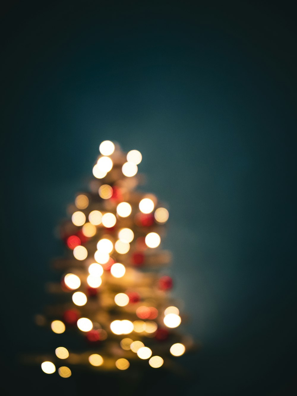 a small christmas tree with many lights on it