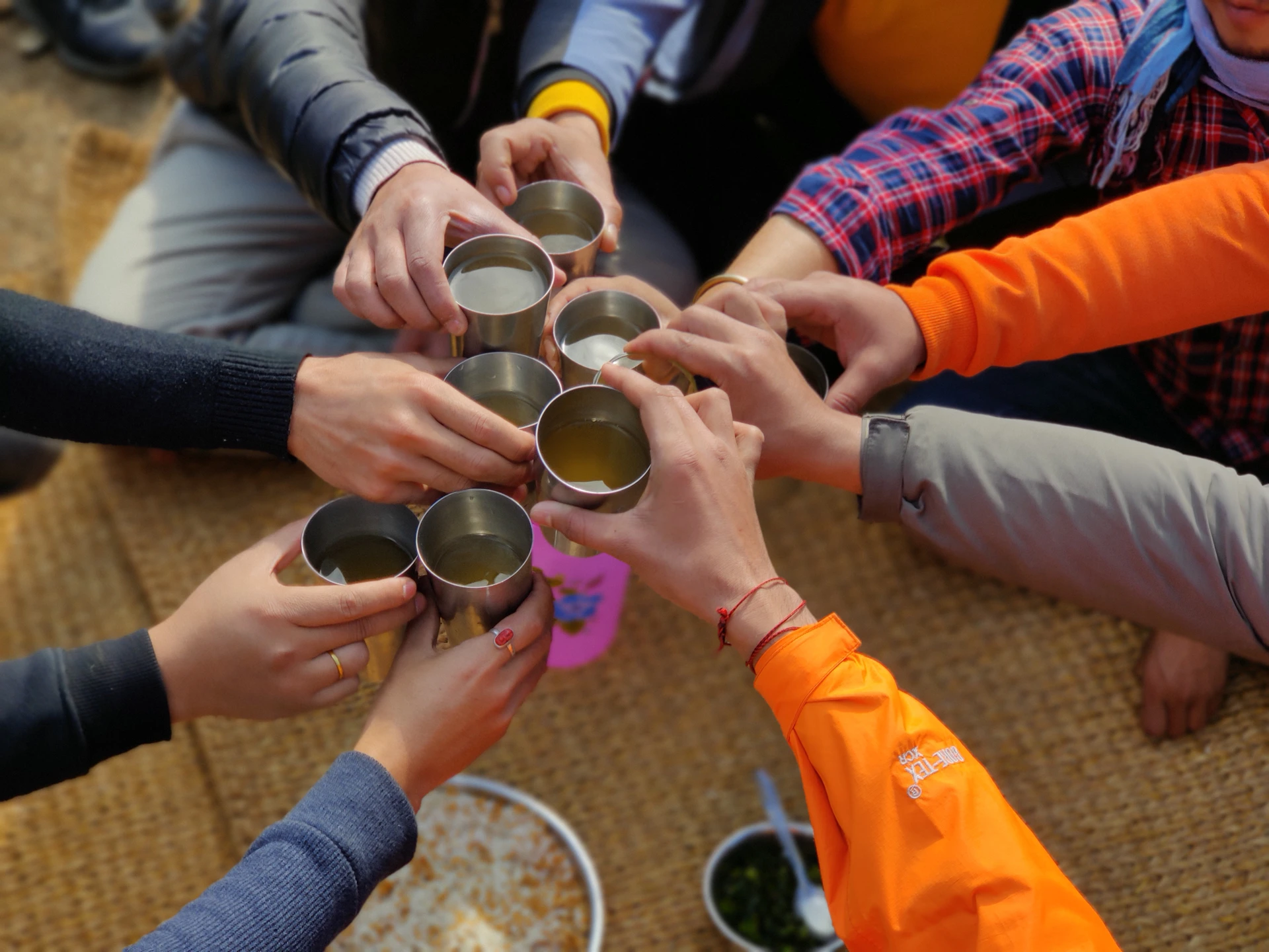 a group of people are holding their hands together