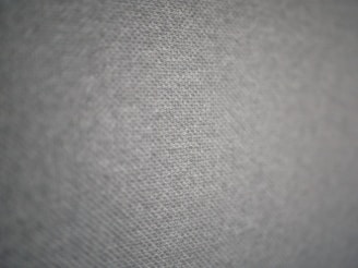 Close-up of a premium fabric shirt with a subtle, original graphic that sparks smiles.