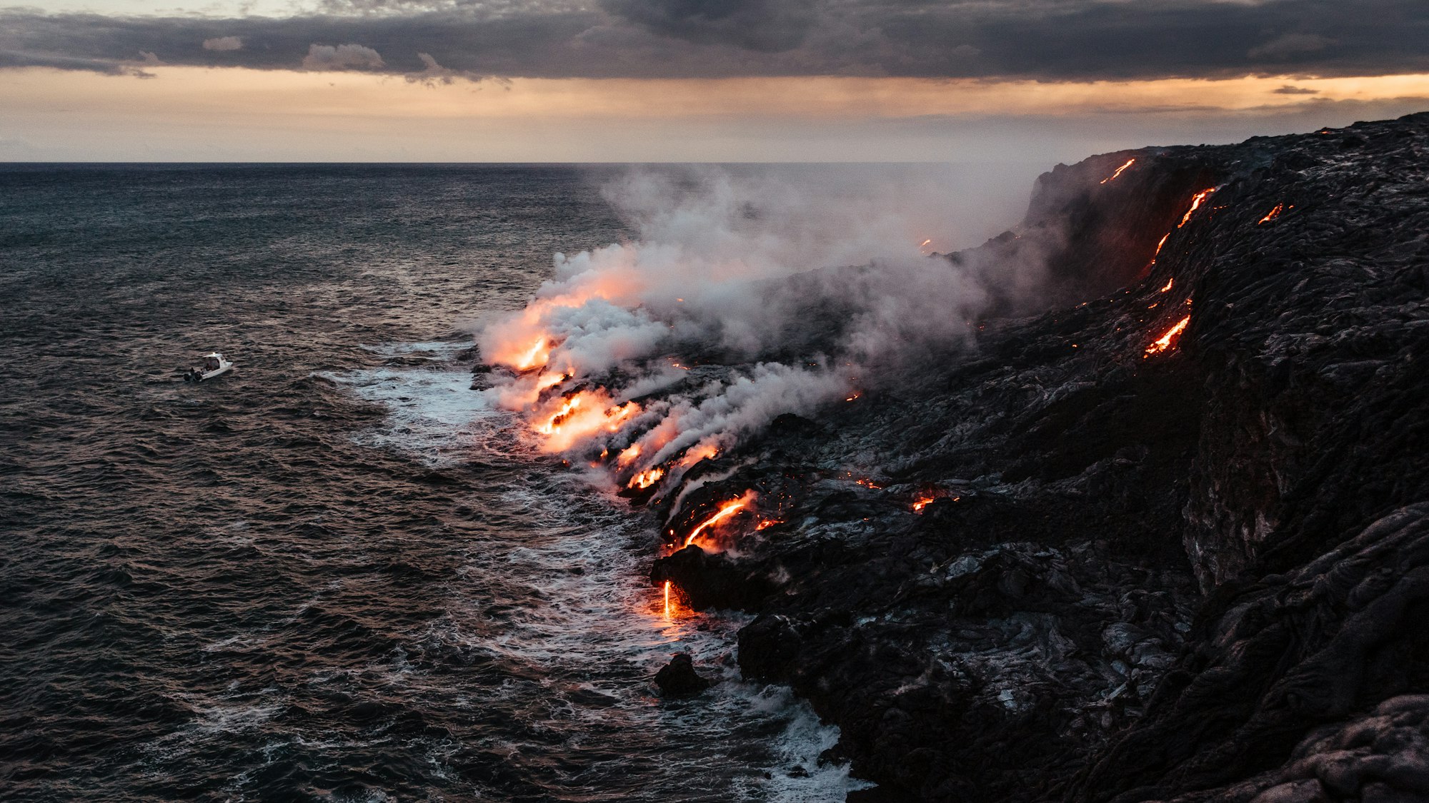 Lava from the Kilauea volcano hitting the ocean.