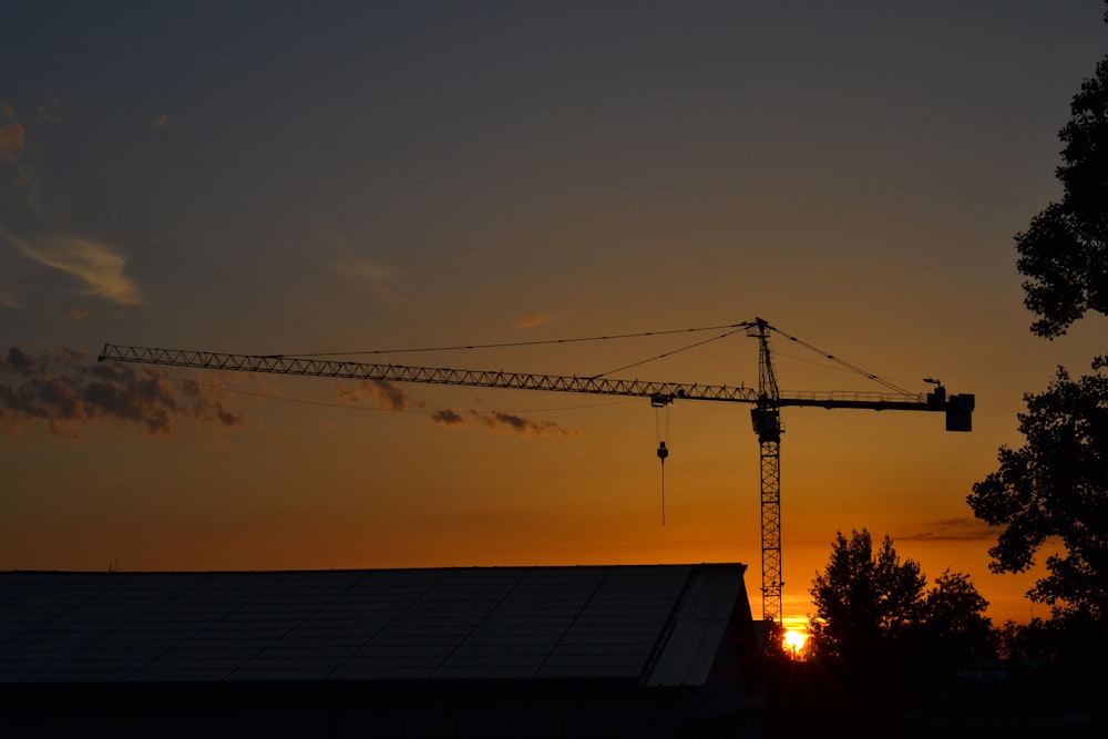 gray tower crane during golden hour