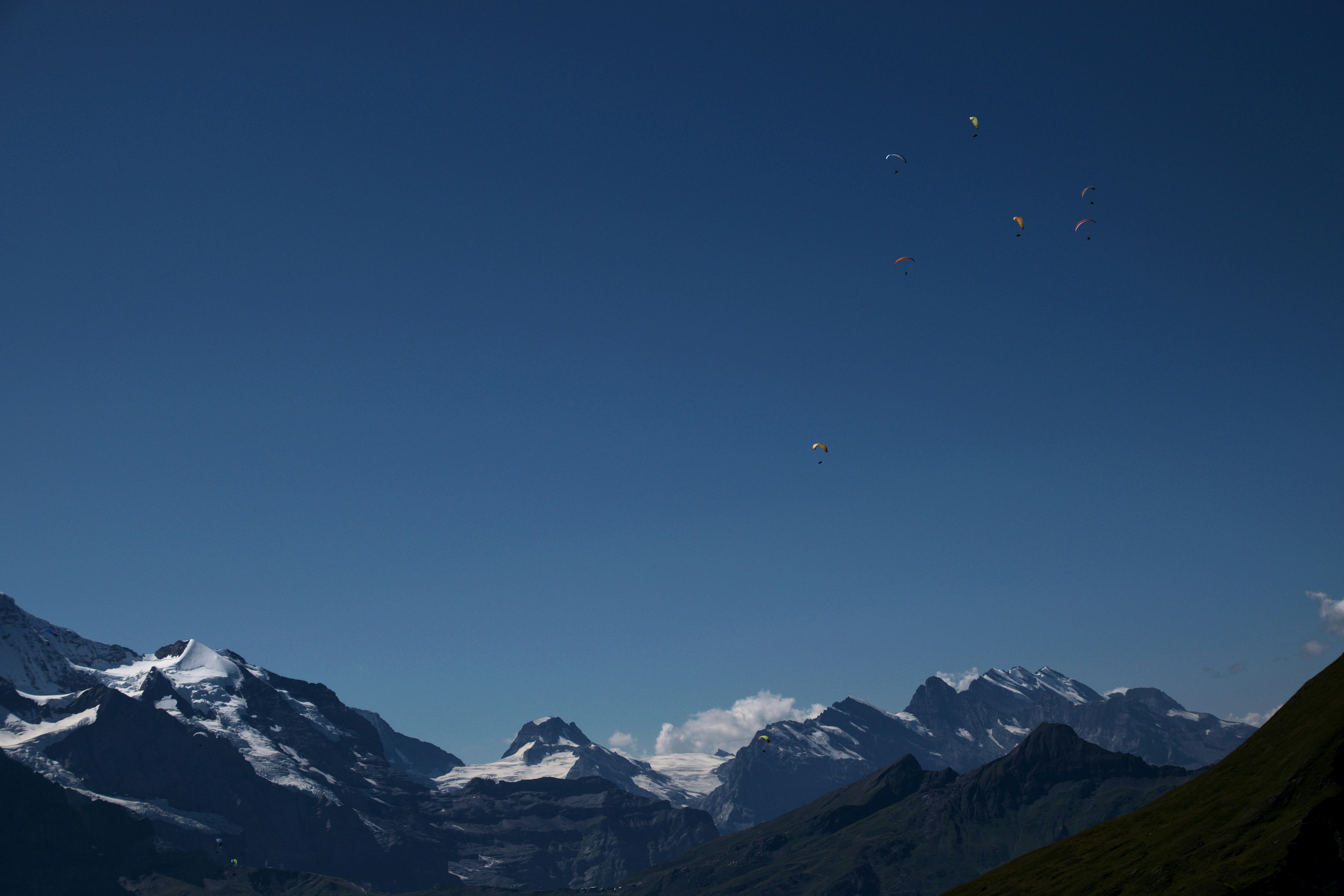 This photo of paragliders was taken overlooking Grindelwald, Switzerland