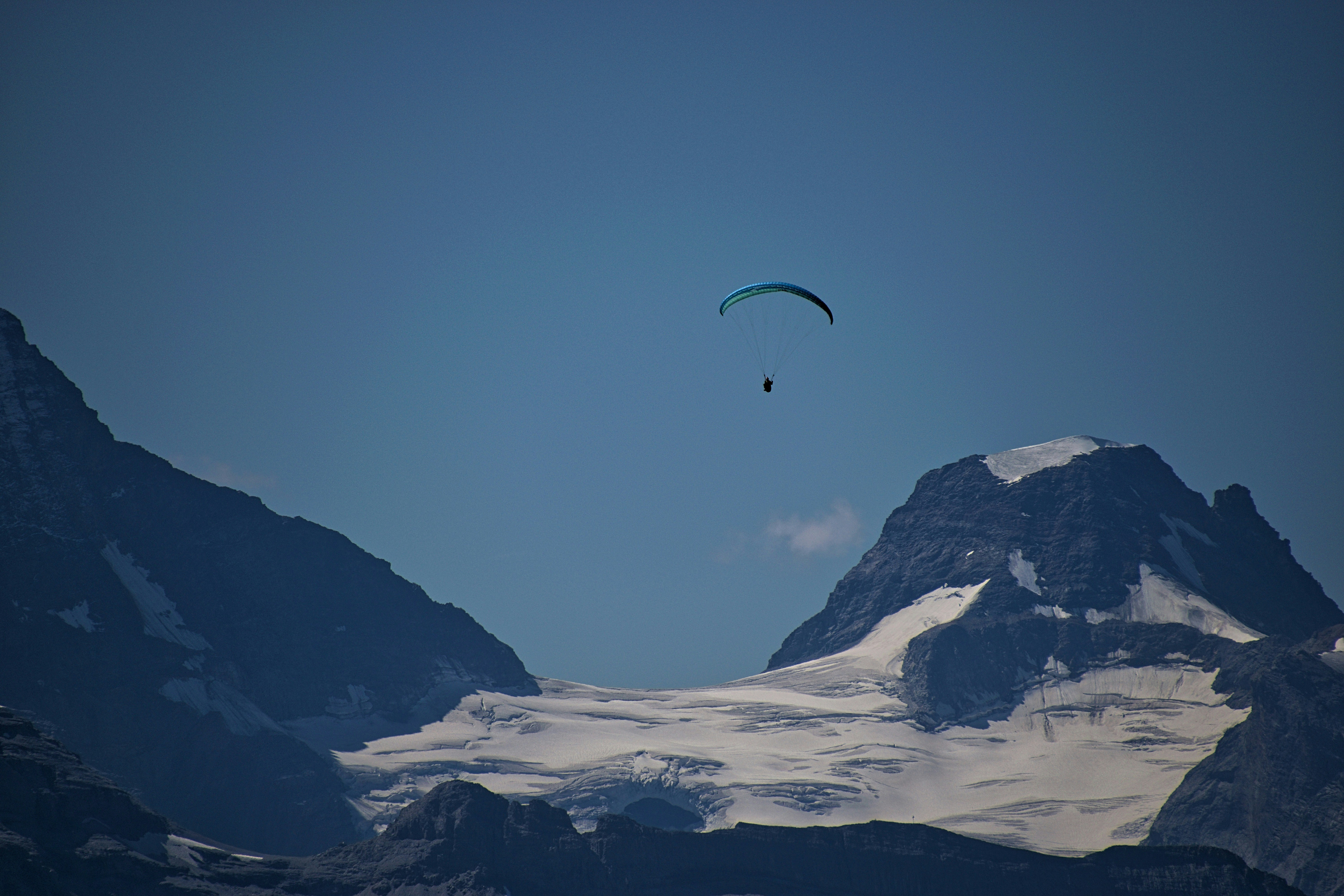 This photo of a lone paraglider was taken overlooking Grindelwald, Switzerland