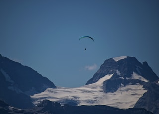 person riding paragliding