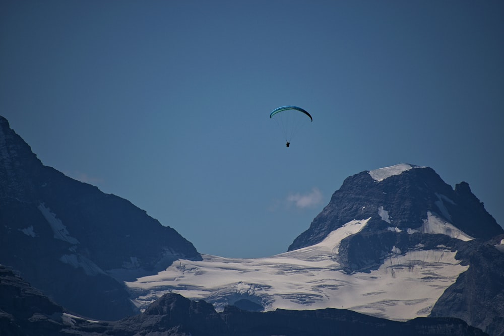 person riding paragliding