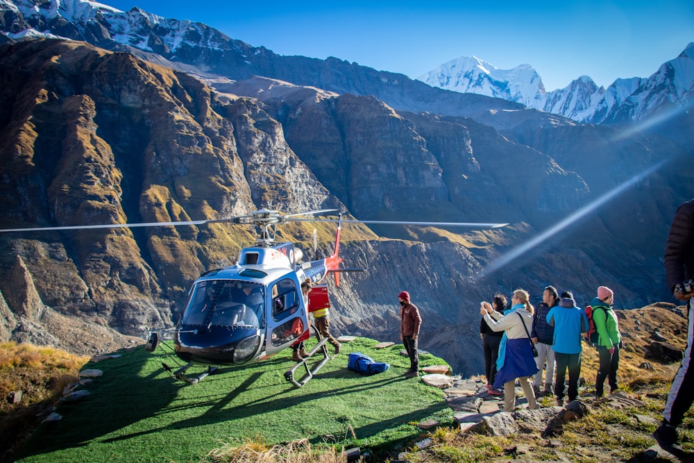 man standing beside the helicopter