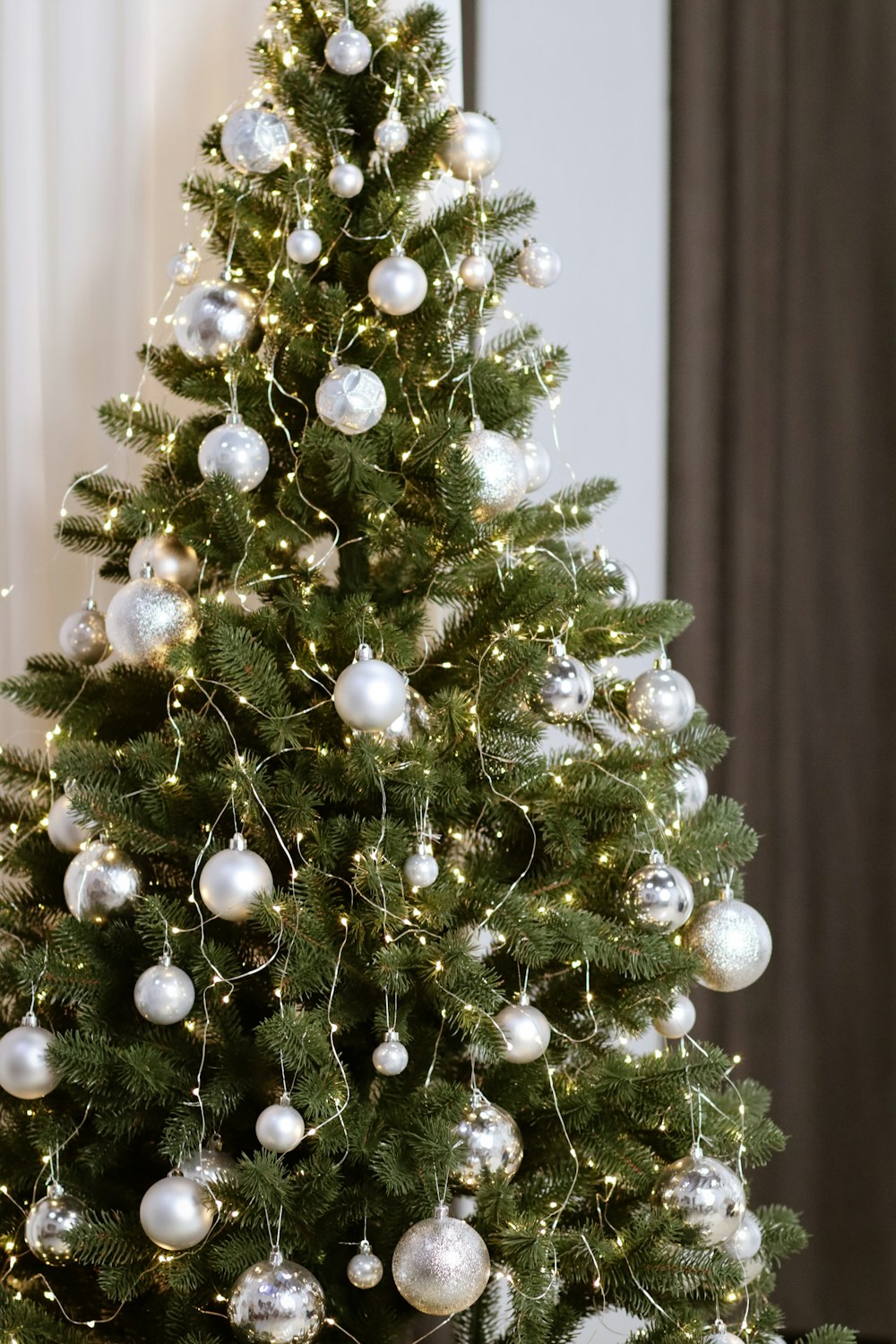 green Christmas tree with gray baubles