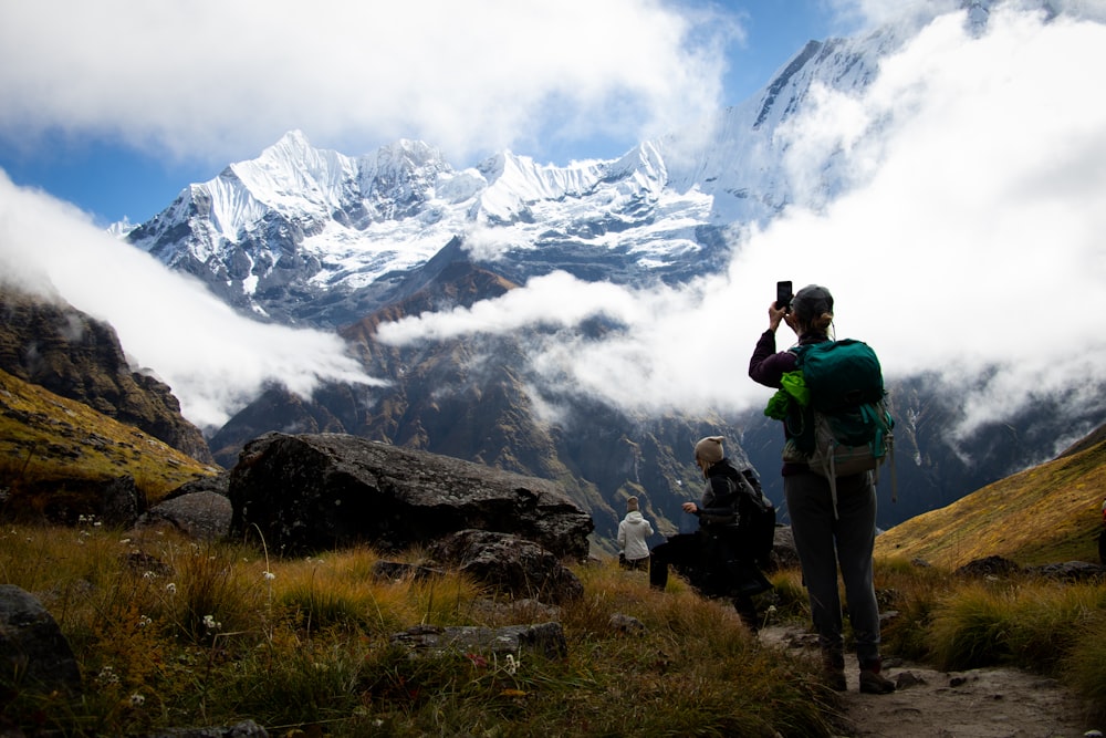 three person on mountain