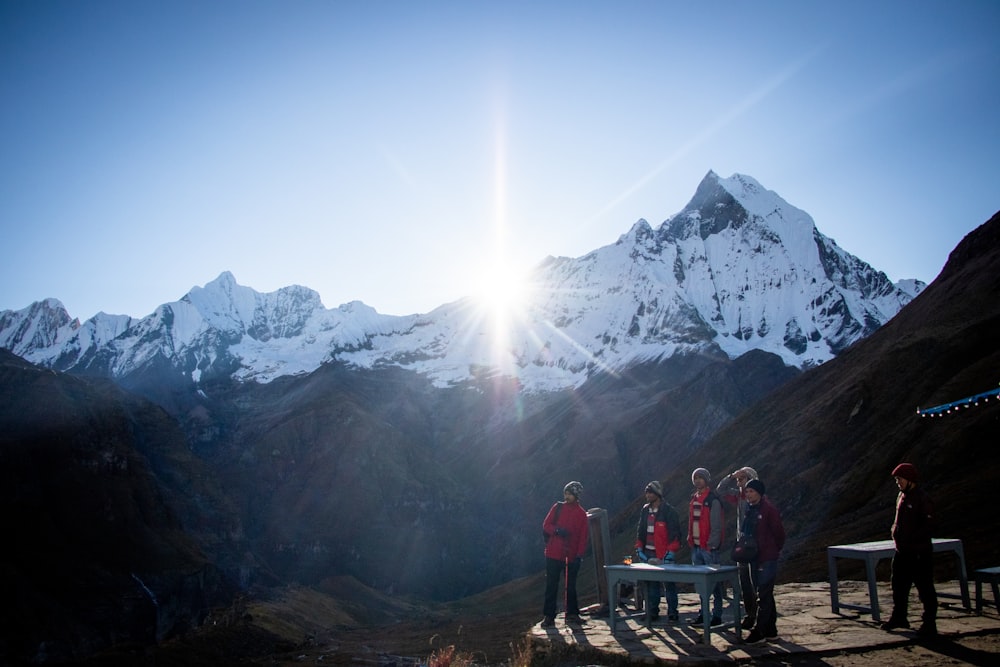 group of people near the mountain