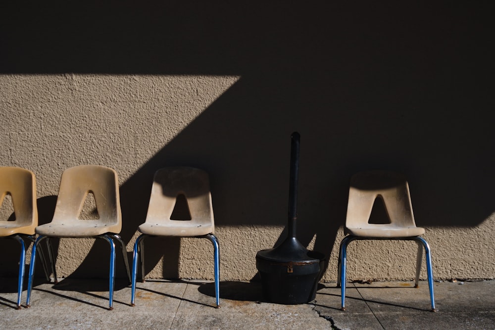 four beige chairs