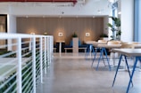 white-and-blue tables facing white balustrade