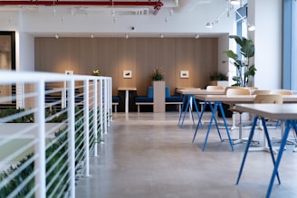 white-and-blue tables facing white balustrade