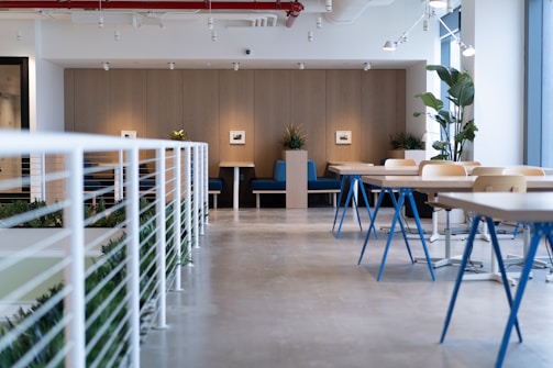 white-and-blue tables facing white balustrade
