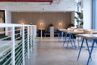white-and-blue tables facing white balustrade
