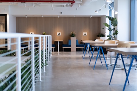 white-and-blue tables facing white balustrade