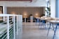 white-and-blue tables facing white balustrade