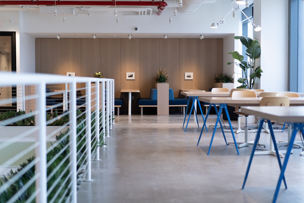 white-and-blue tables facing white balustrade