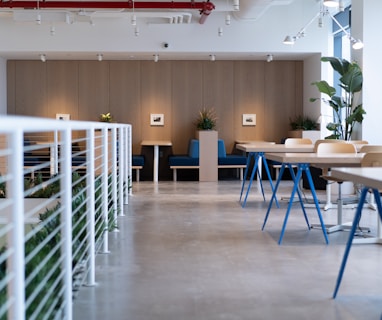 white-and-blue tables facing white balustrade