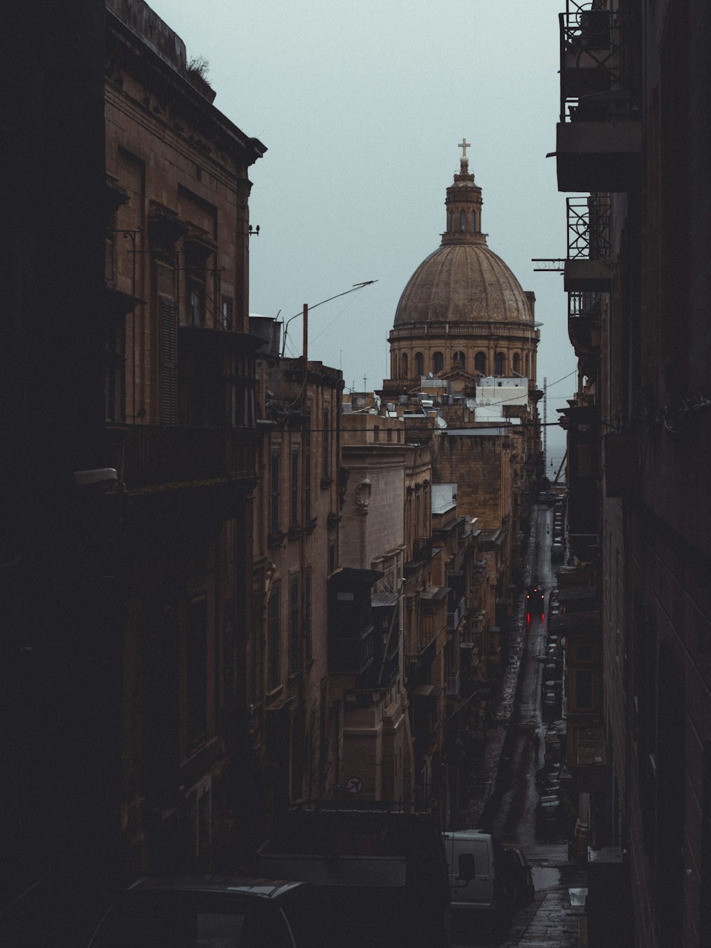 road between cathedral and buildings