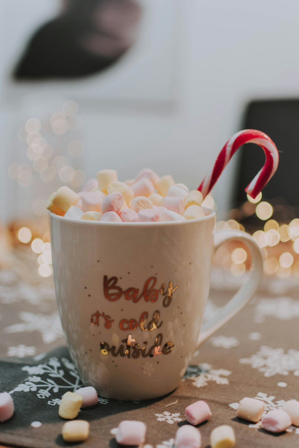 white ceramic mug full of marshmallows