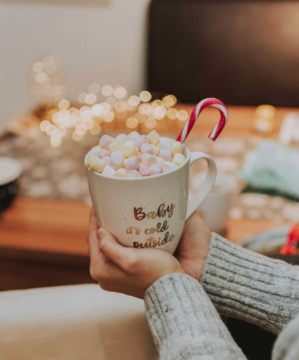 white ceramic mug full of marshmallows