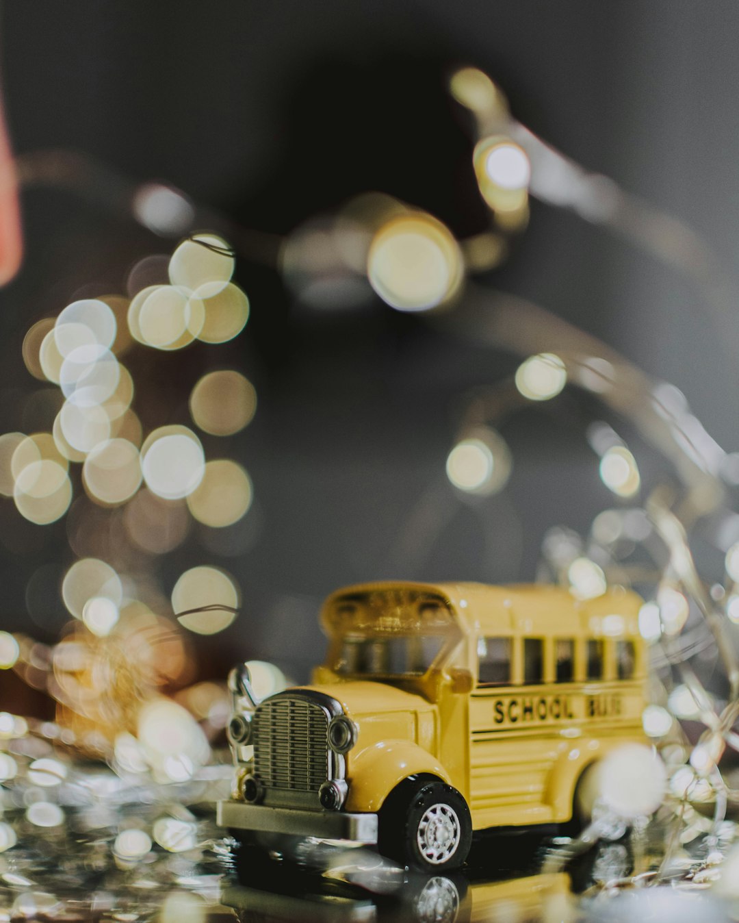 selective focus photo of yellow toy school bus