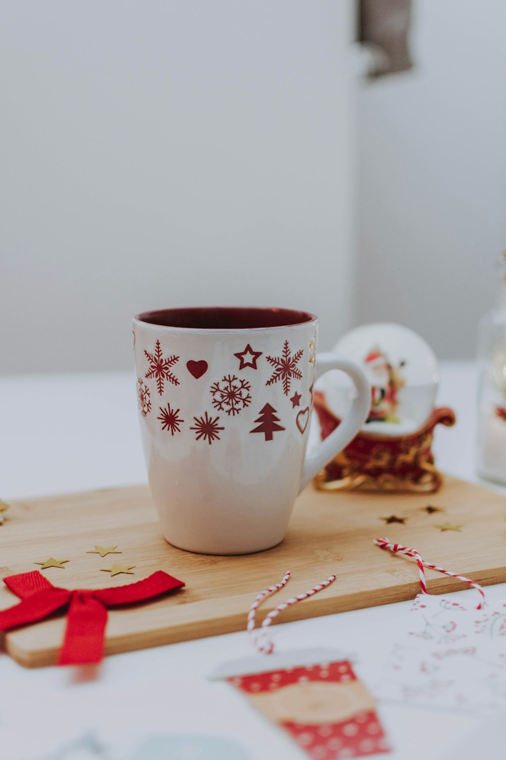white and red ceramic Christmas mug