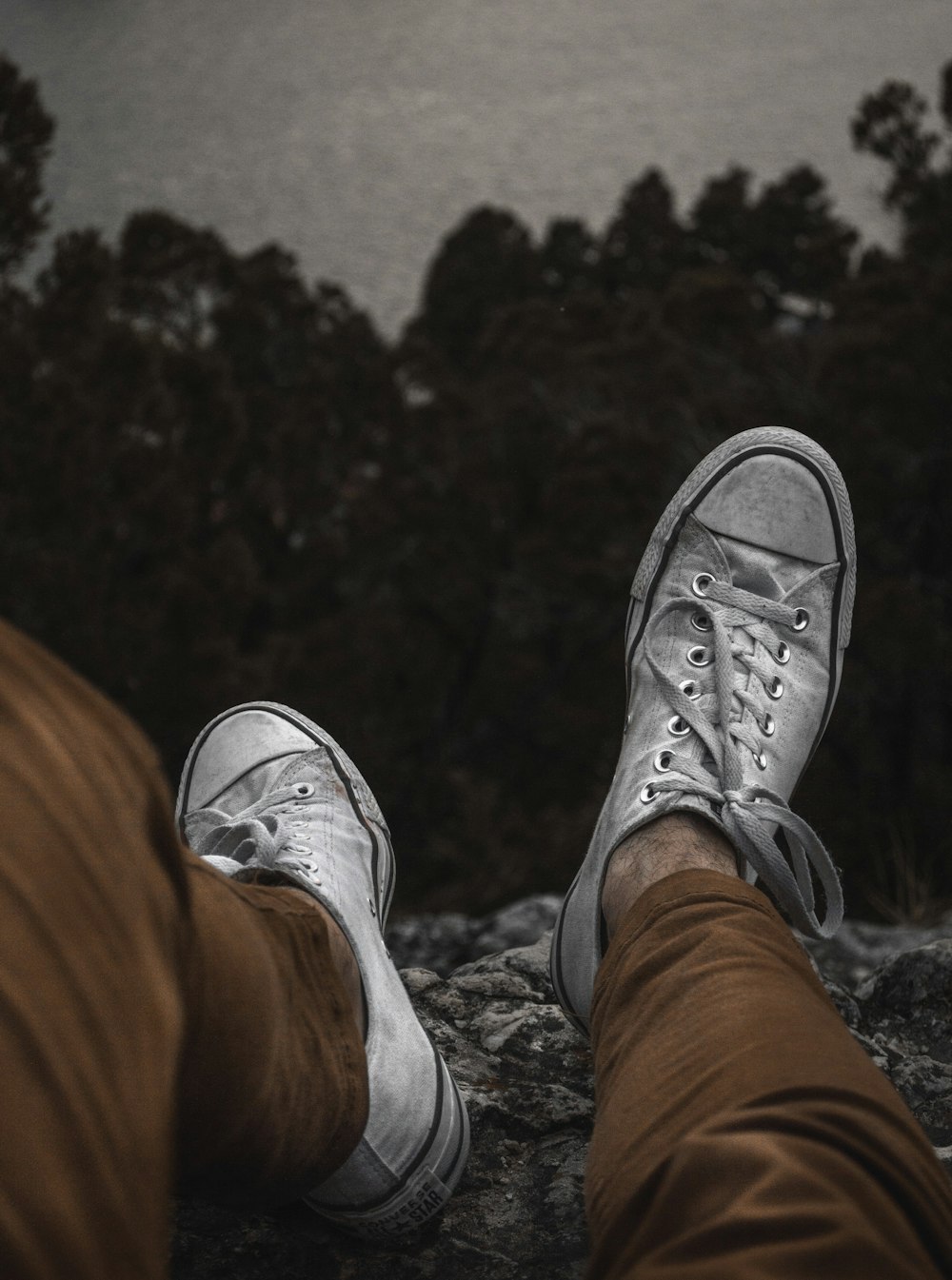 person wearing white sneakers