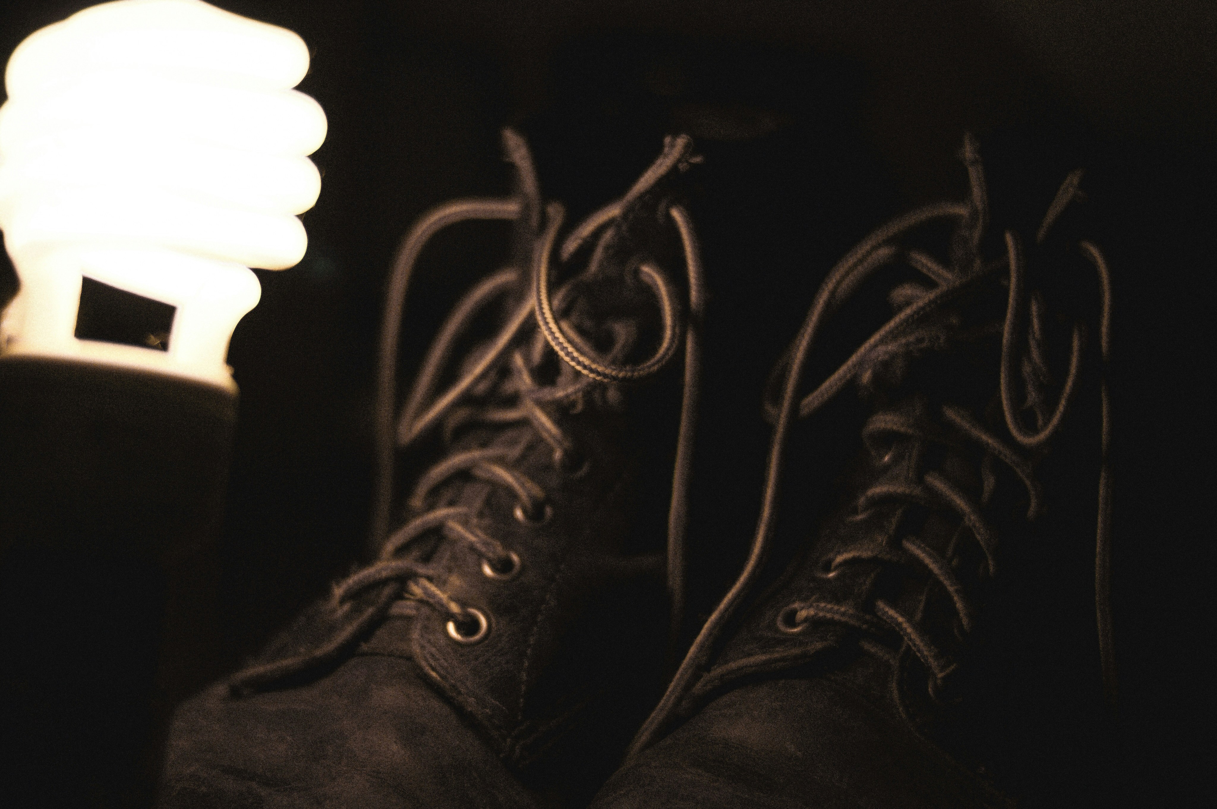 pair of black leather boots