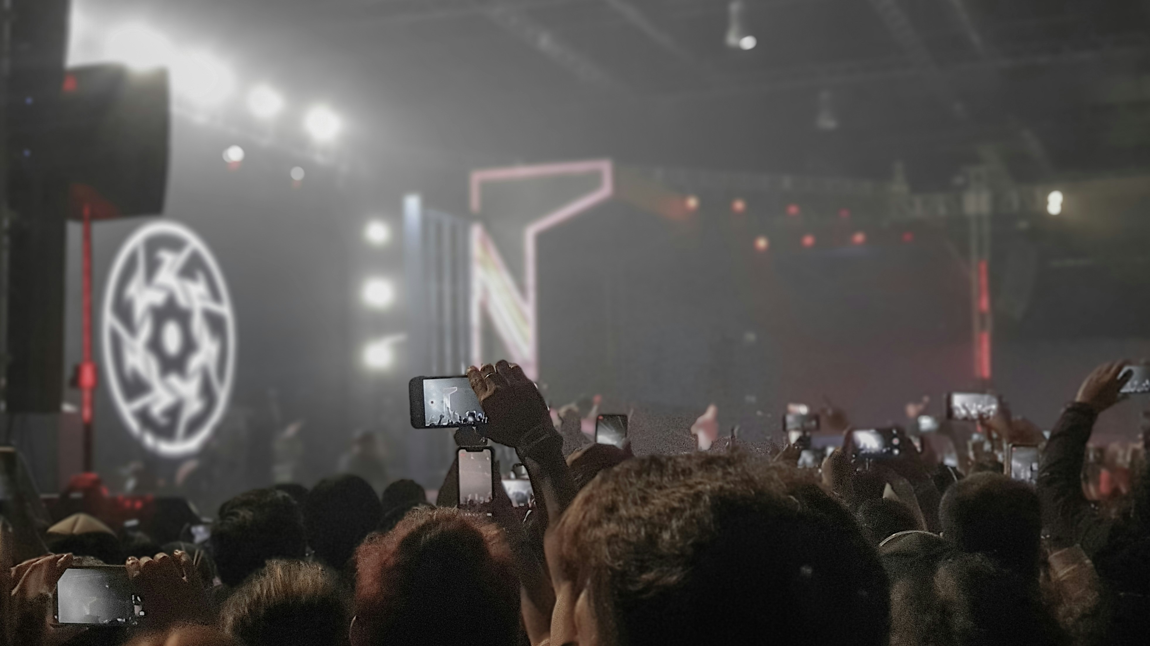 people holding smartphones inside building, A concert crowd.