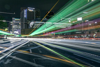 A vibrant cityscape photo showcasing dynamic light trails at night.