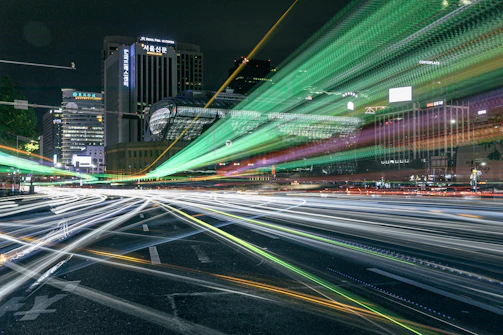 A vibrant cityscape photo showcasing dynamic light trails at night.