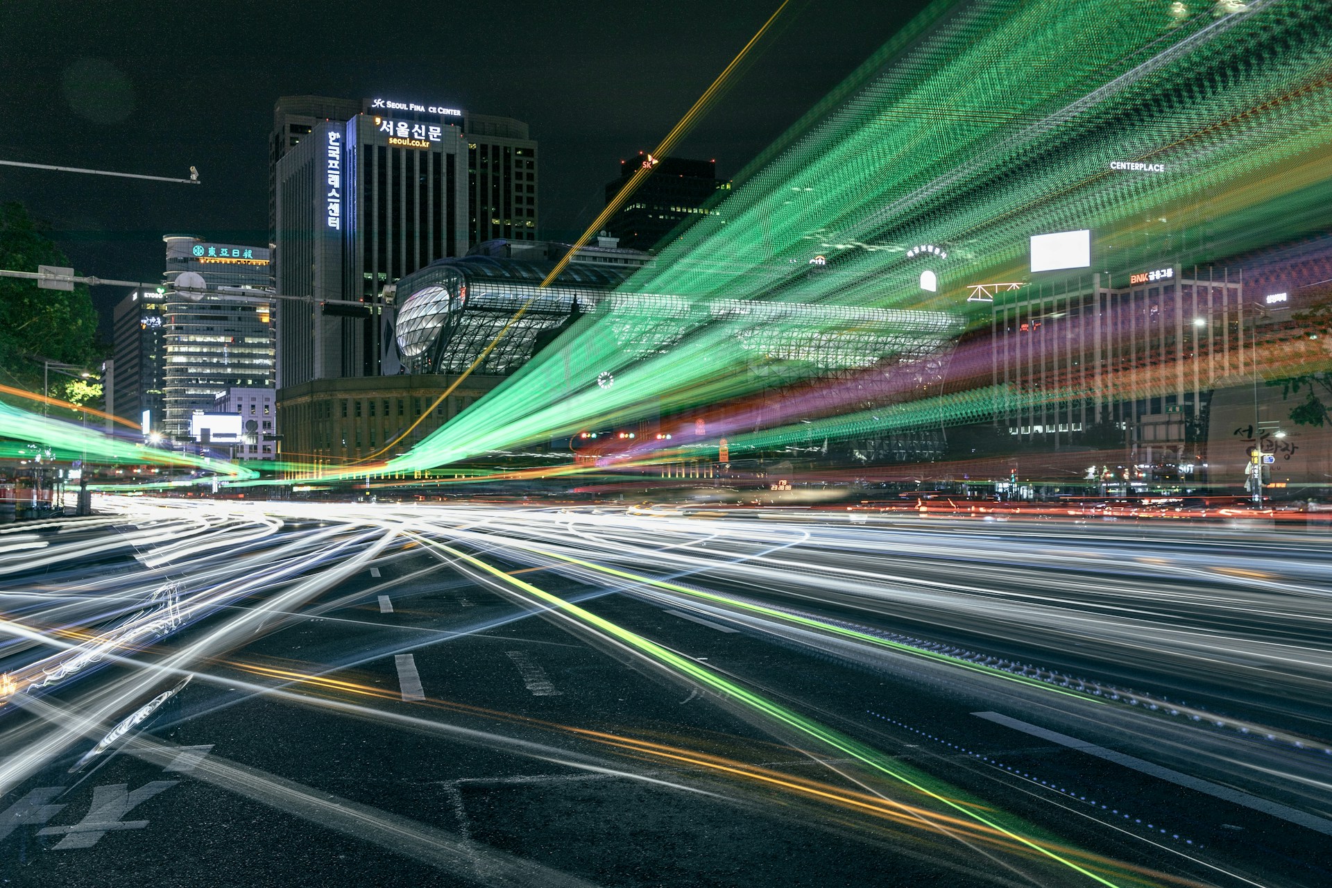 A vibrant cityscape at dusk with dynamic light trails illustrating movement and energy.