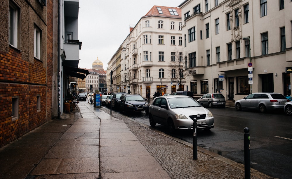 vehicles parked beside curb during daytime