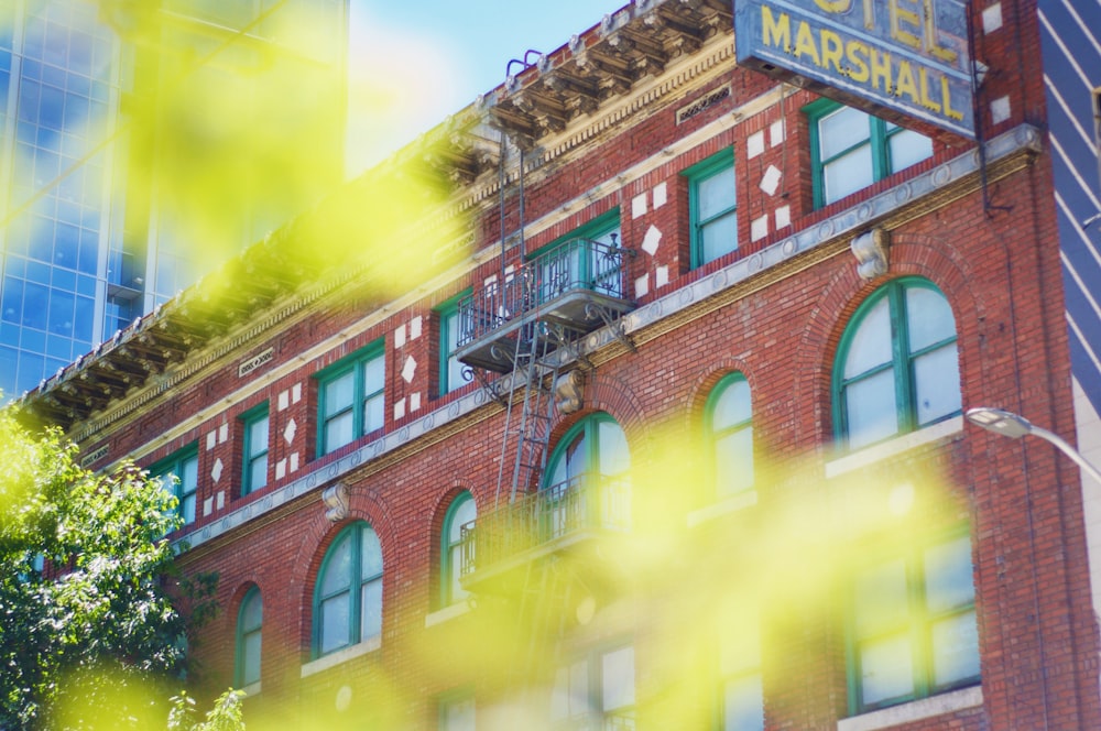 a red brick building with a sign on top of it