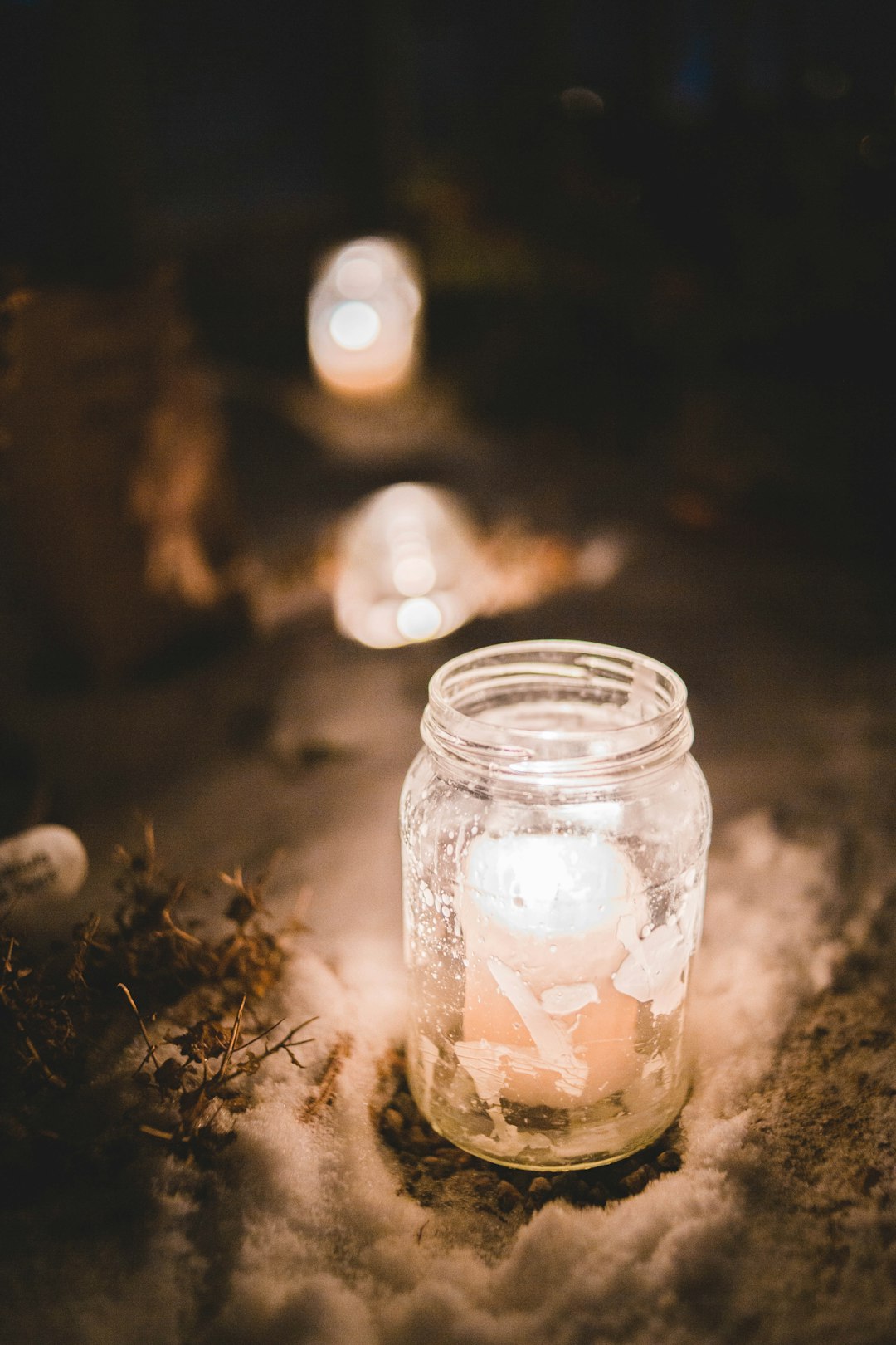 selective focus photography of lit candles in mason jar
